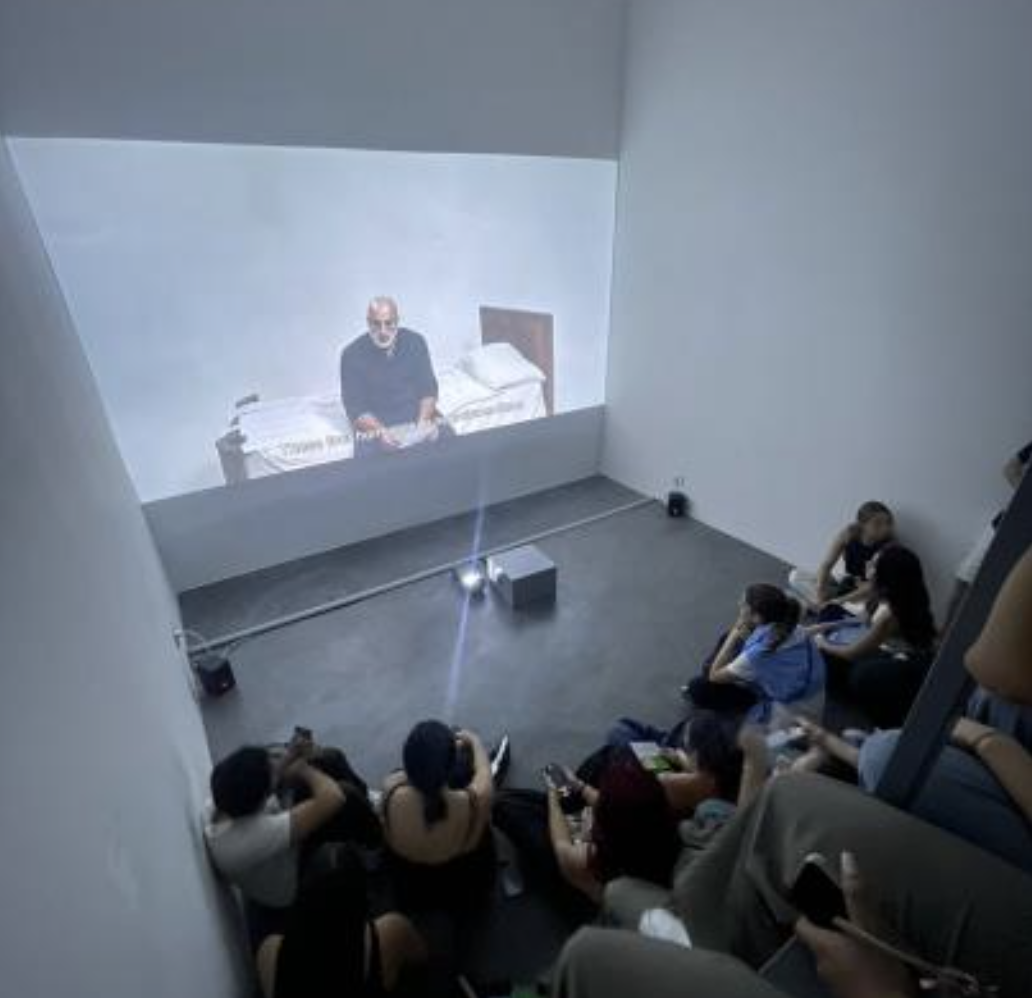 gallery view with audience watching a video